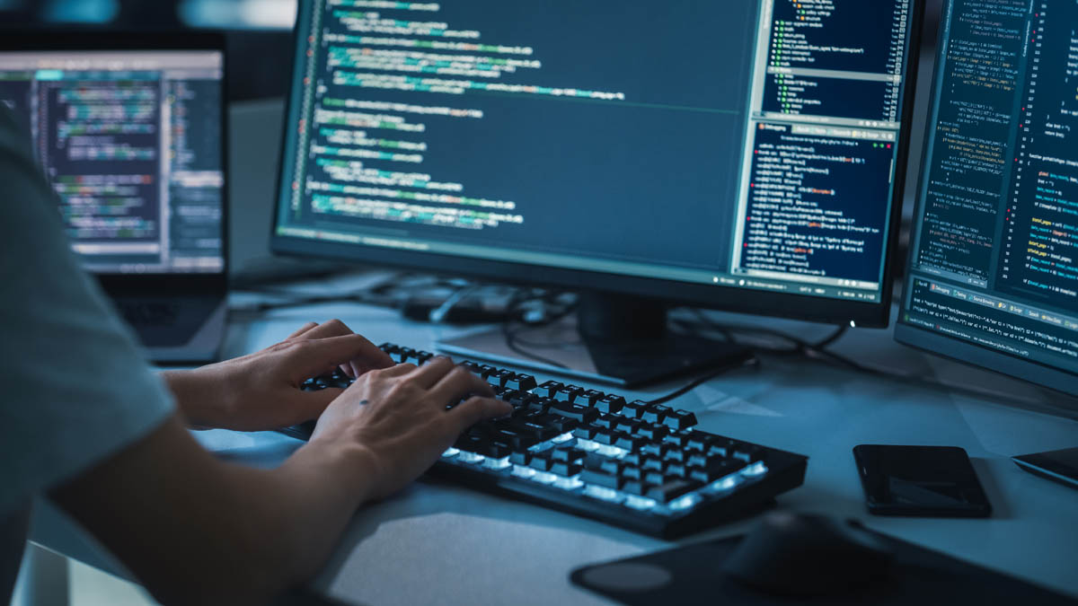 Software engineer typing on keyboard.