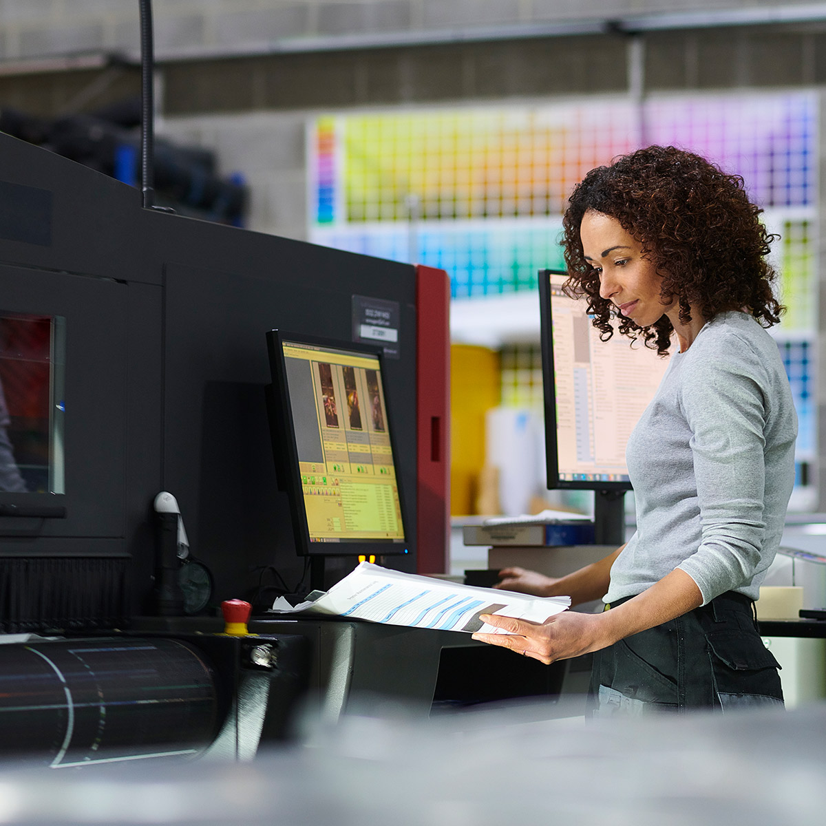 Woman working in print shop